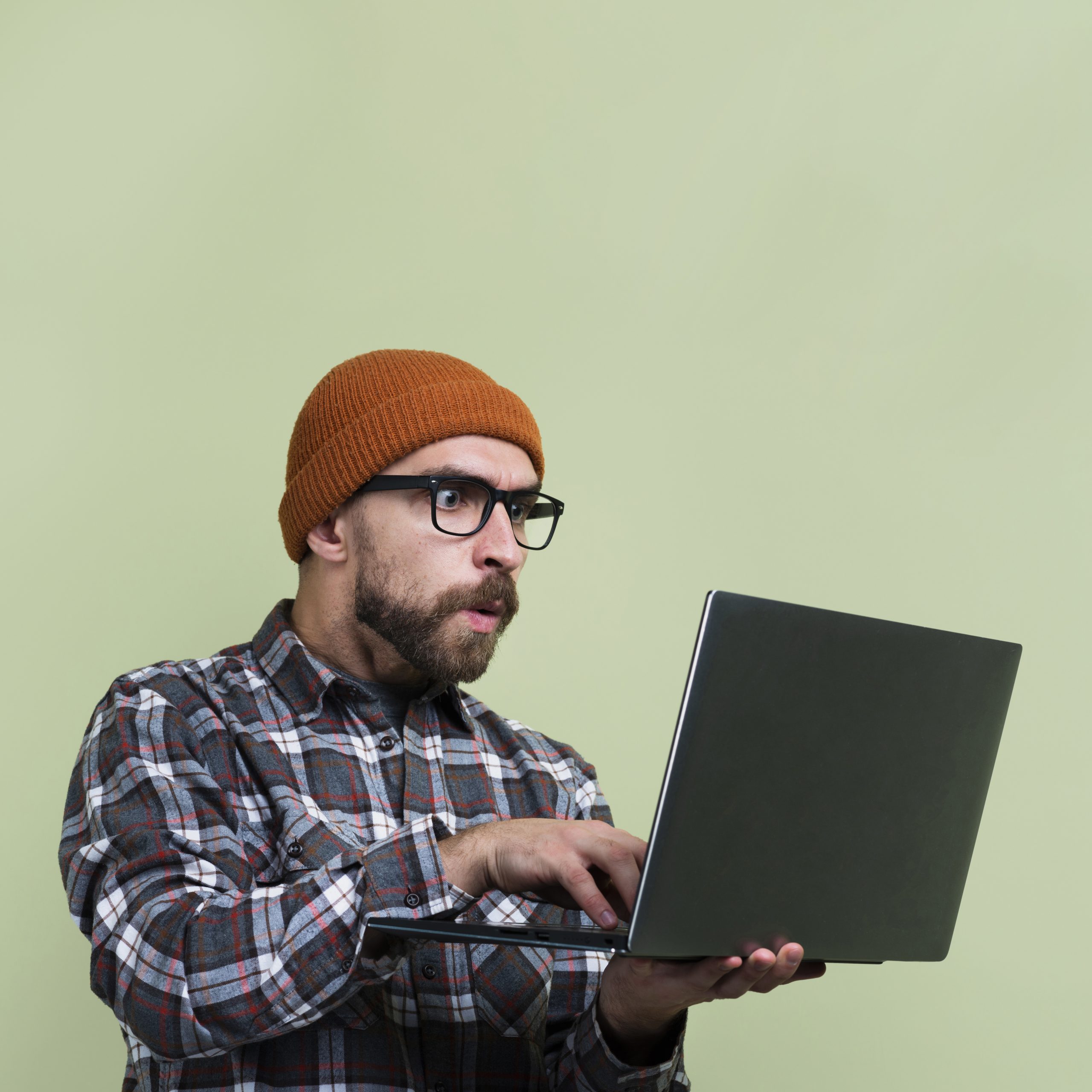 surprised man looking laptop scaled
